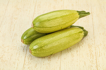 Young tasty zucchini over board