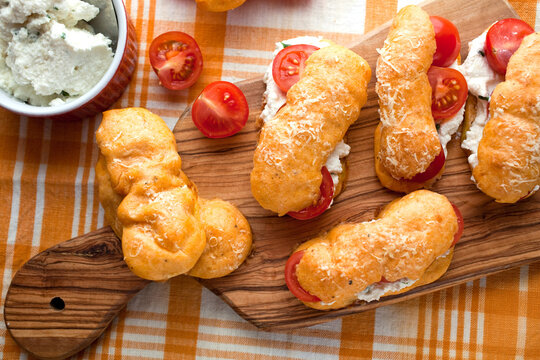 Close up of eclairs filled with tomatoes, ricotta and basil