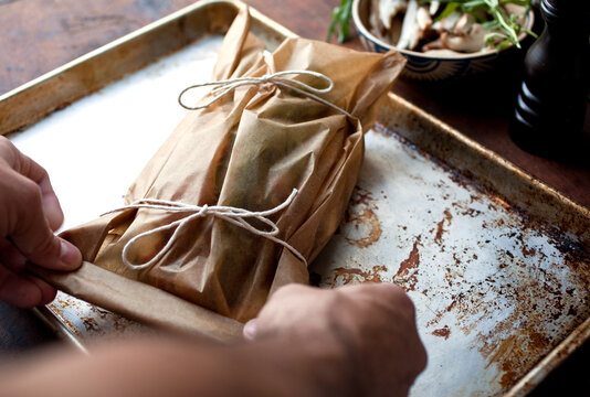 Close up of baked vegetables in paper package