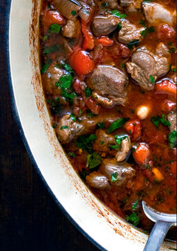 Overhead view of Spanish style lamb stew in pot