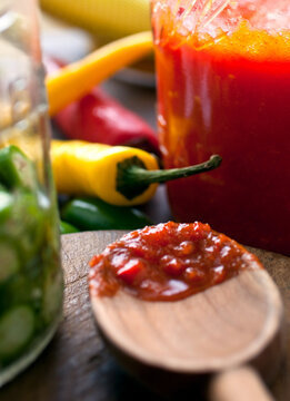Close up of jars with chili and spicy sauce