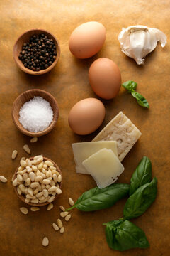 Close up of eggs, cheese, seeds, salt and black pepper on table