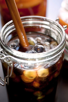 Close up of jar with boozy concord grapes