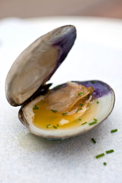 Close up of clams with lemon cayenne butter