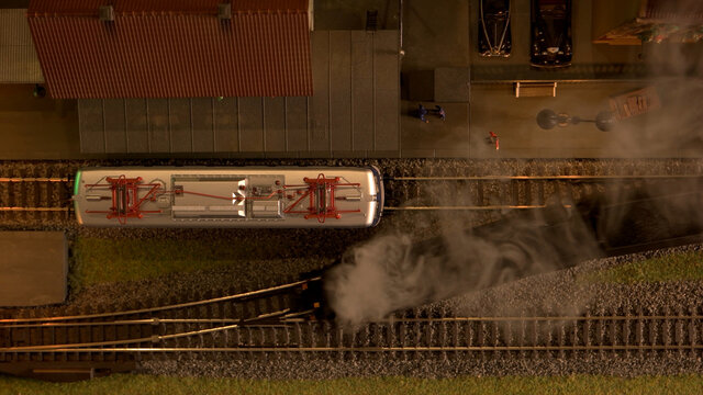 Top view retro railway station. Replica of steam lokomotives on a railroad.