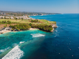 Blue ocean and cliff at background. Aerial view of tropical island with wave