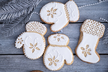 Obraz na płótnie Canvas Christmas cookies decorated with royal icing on wooden table