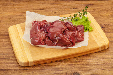 Raw chicken liver over board