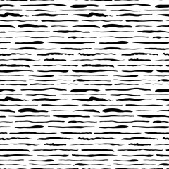 Grunge lines vector seamless pattern. Horizontal dashes, dotted lines, brush strokes or straight stripes. Black ink striped hand drawn background. Geometric ornament for wrapping paper. 