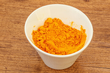 Tumeric powder in the bowl