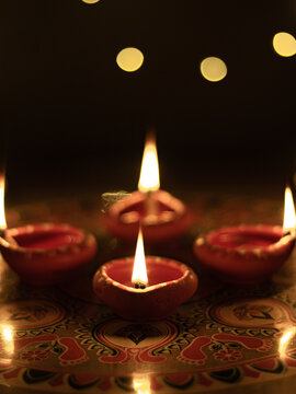 Clay Diya  or lamp with rangoli  stock image.