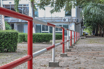 Long red and white iron fence, taken in Thammasat University.