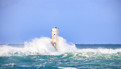 Lighthouse sea waves rain storm
