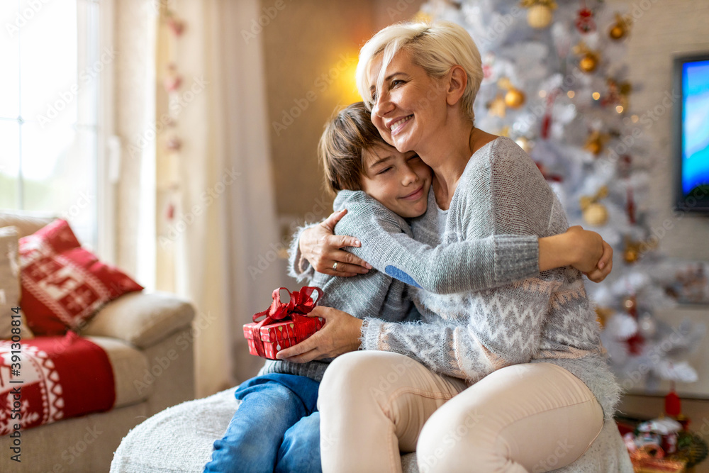 Canvas Prints happy son giving mother christmas gift