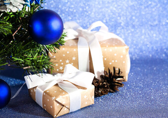 Christmas composition with Christmas tree, gift boxes and decorations. Close-up. Concept of congratulations for Christmas and New Year.