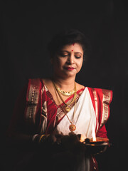 A Woman wearing red and white saree stock image.