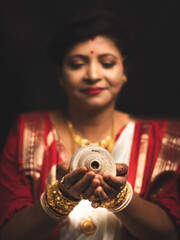 A Woman wearing red and white saree stock image.