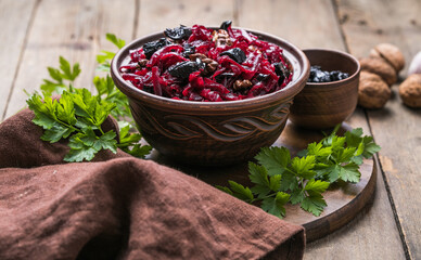 Christmas salad with beets, prunes and nuts