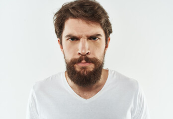 Man with beard in white t-shirt cropped view of emotion model