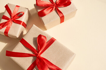 Presents with red ribbon on the bright background .,,