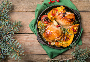 Roasted Christmas Chicken  thighs with pumpkin   for Christmas Dinner. Festive decorated wooden table