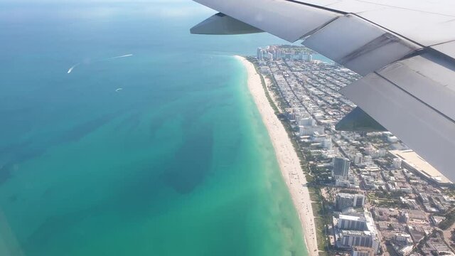 Beautiful aerial view of Miami landscape from window of landing aircraft. 