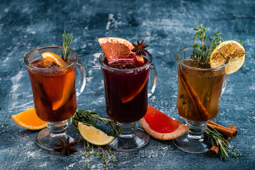 Various autumn or winter seasonal alcohol hot cocktails - mulled wine, grog, warm ginger ale, hot rum, punch, mulled apple cider