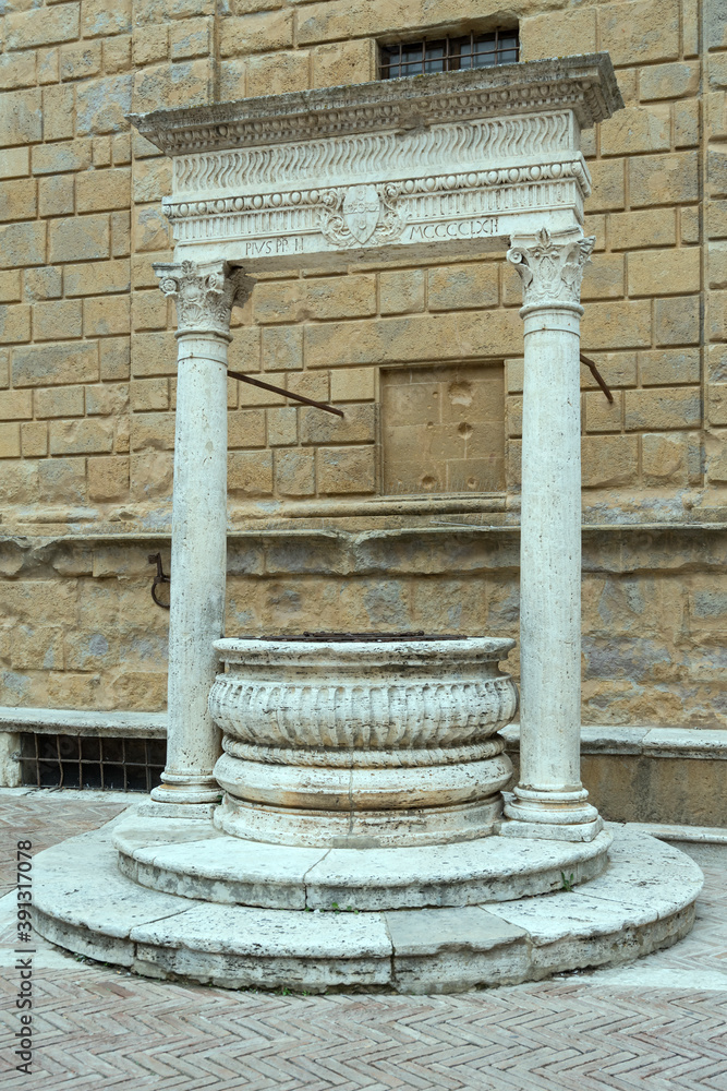 Wall mural marble well at Piccolomini Renaissance palace, Pienza, Siena, Italy