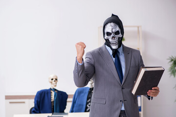 Funny business meeting with devil and skeletons