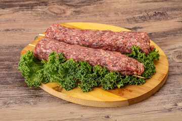Raw minced beef kebab skewer