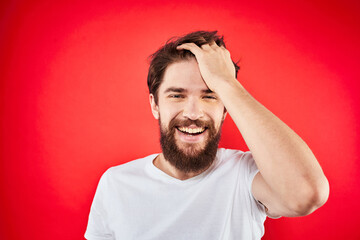 Bearded man fun emotions lifestyle cropped view white t-shirt red background