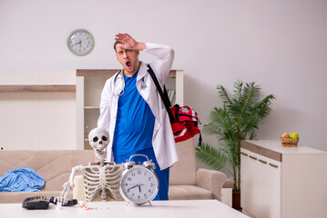Young male paramedic visiting skeleton patient
