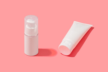 Blank white tube design on a pink background. Mockup