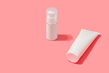 Blank white tube design on a pink background. Mockup