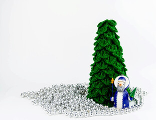 Christmas composition crocheted fir tree and santa claus.