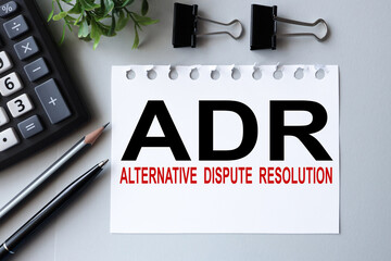 adr, text on white paper on gray background