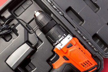 Naklejka premium Electric screwdriver in the box