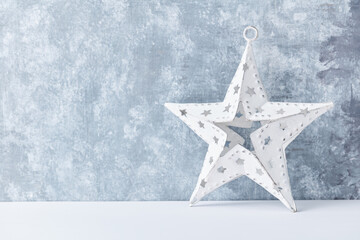 Christmas star on bright wooden background. Close up. 