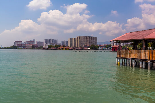 Modern Penang meets the clan jetties in George Town, Penang Island, Malaysia, Asia