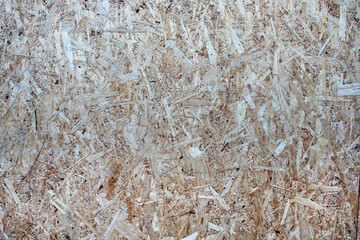 Shredded wood texture. Pressed sawdust board.