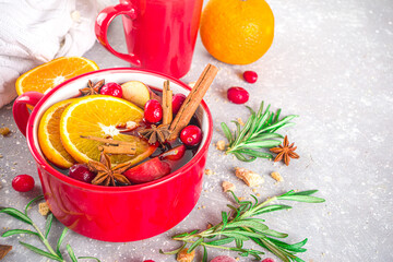Mulled Wine Hot Drink with Citrus and Spices, Traditional Autumn Winter Warm Alcohol Beverage, in...