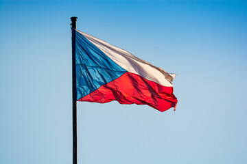 Prague, Czech republic - September 19, 2020. Flag of Czechia flying in the wind on the blue sky