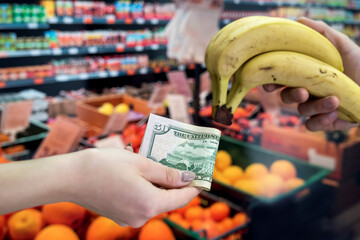 man who takes care of his health buys fruit in a store