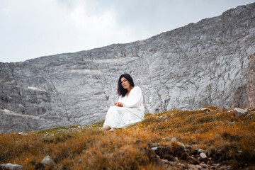 A woman in a white dress on the highest mountain in Bulgaria