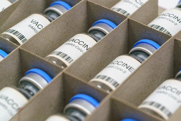 Coronavirus COVID-19 vaccine. SARS-Cov-2 Ncov-2019 vaccine ampoules  in a box.