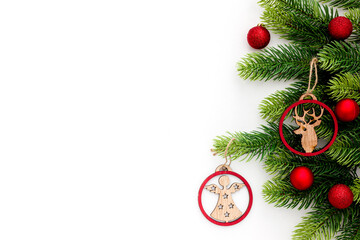 Spruce branch, cones and vintage toys decoration on christmas or new year on white background