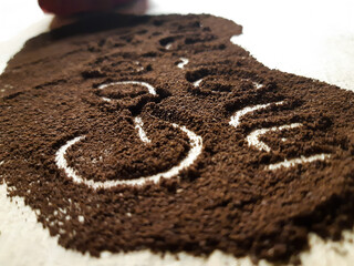 Black coffee on a wooden background.