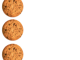 Oatmeal biscuits Photo template with copy space Three homemade cookies on white background in top view