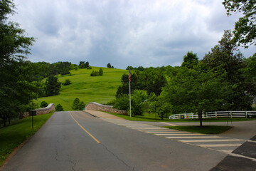Road in America with a field in the background