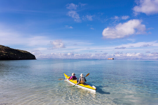 Couple in a kayak, paddling on the Sea of Cortes, also known as the Gulf of California, Mexico.